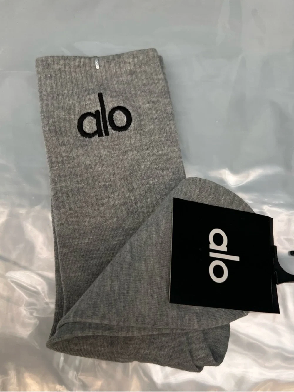 ALO Yoga unisex half crew understated socks in gray embroidered logo